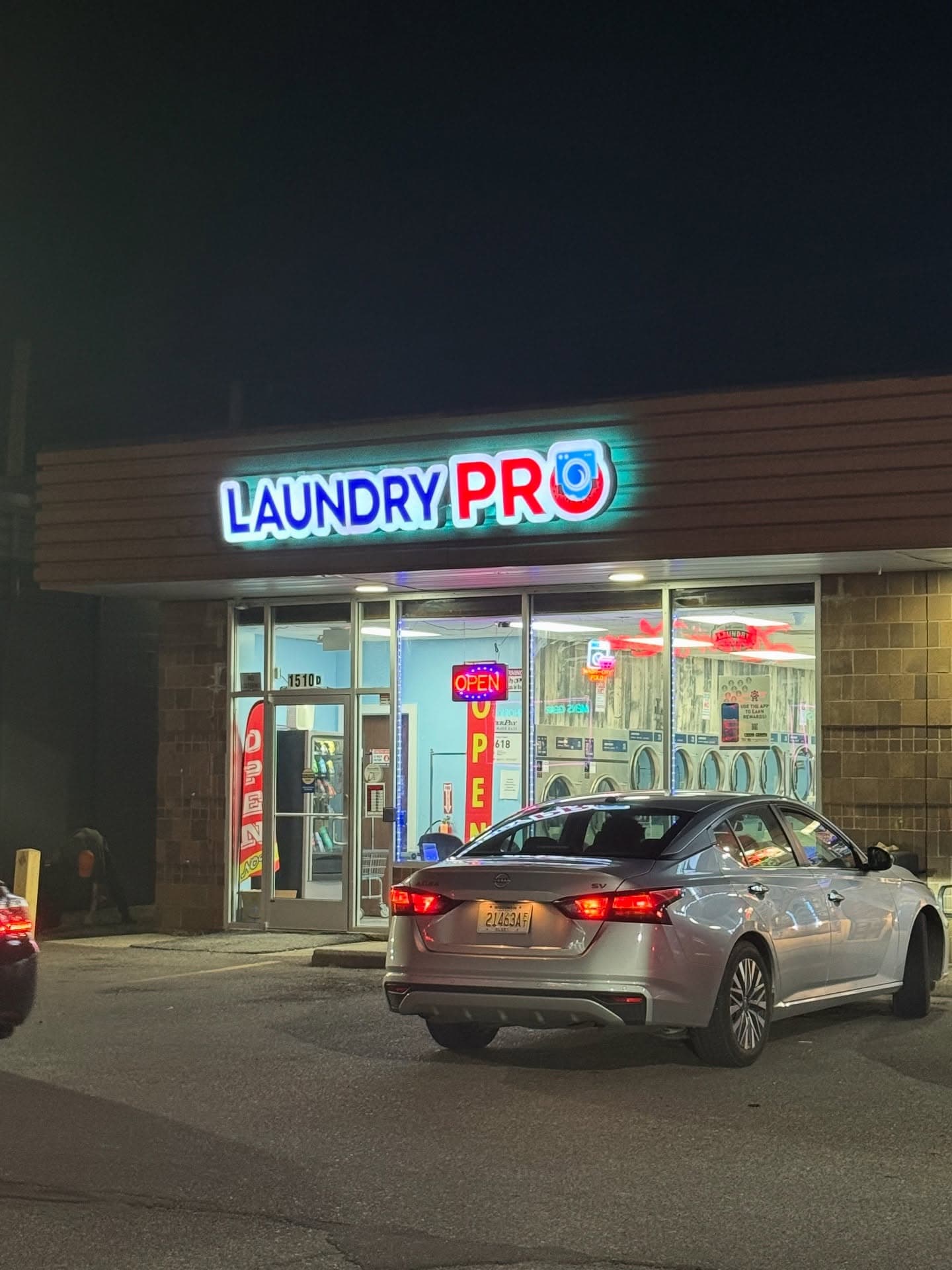 Laundry Pro storefront at night